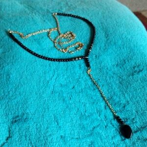 Long black and gold necklace